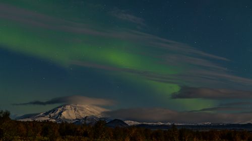 Hekla volcano under aurora